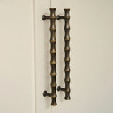 Grove Bamboo Cabinet Handle — Satin antique, satin lacquer. Design by Roseywood Interiors.
