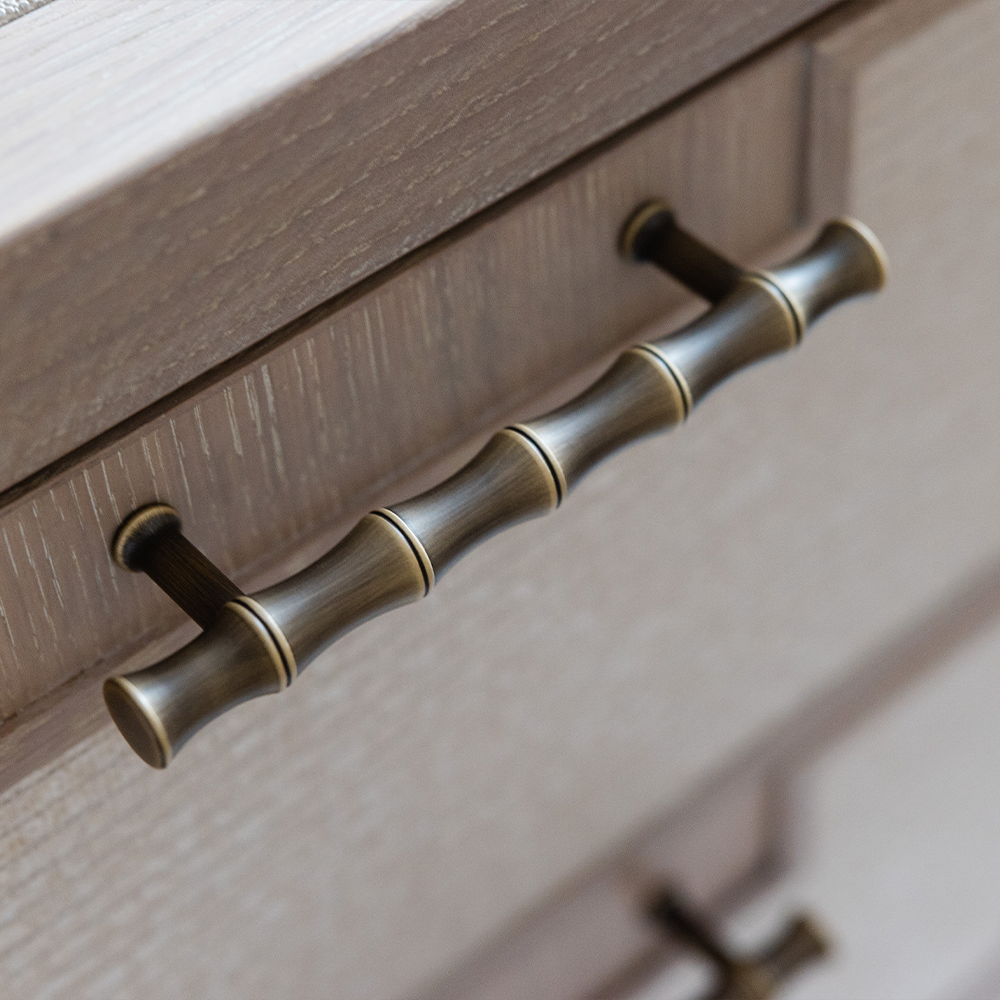 Grove Bamboo Cabinet Handle — Satin antique, satin lacquer. Design by Sophie Paterson Interiors.