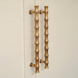 Grove Bamboo Cabinet Handle — room setting, Aged brass