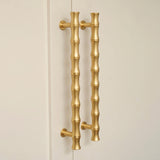 Grove Bamboo Cabinet Handle — room setting, Satin brass lacquered