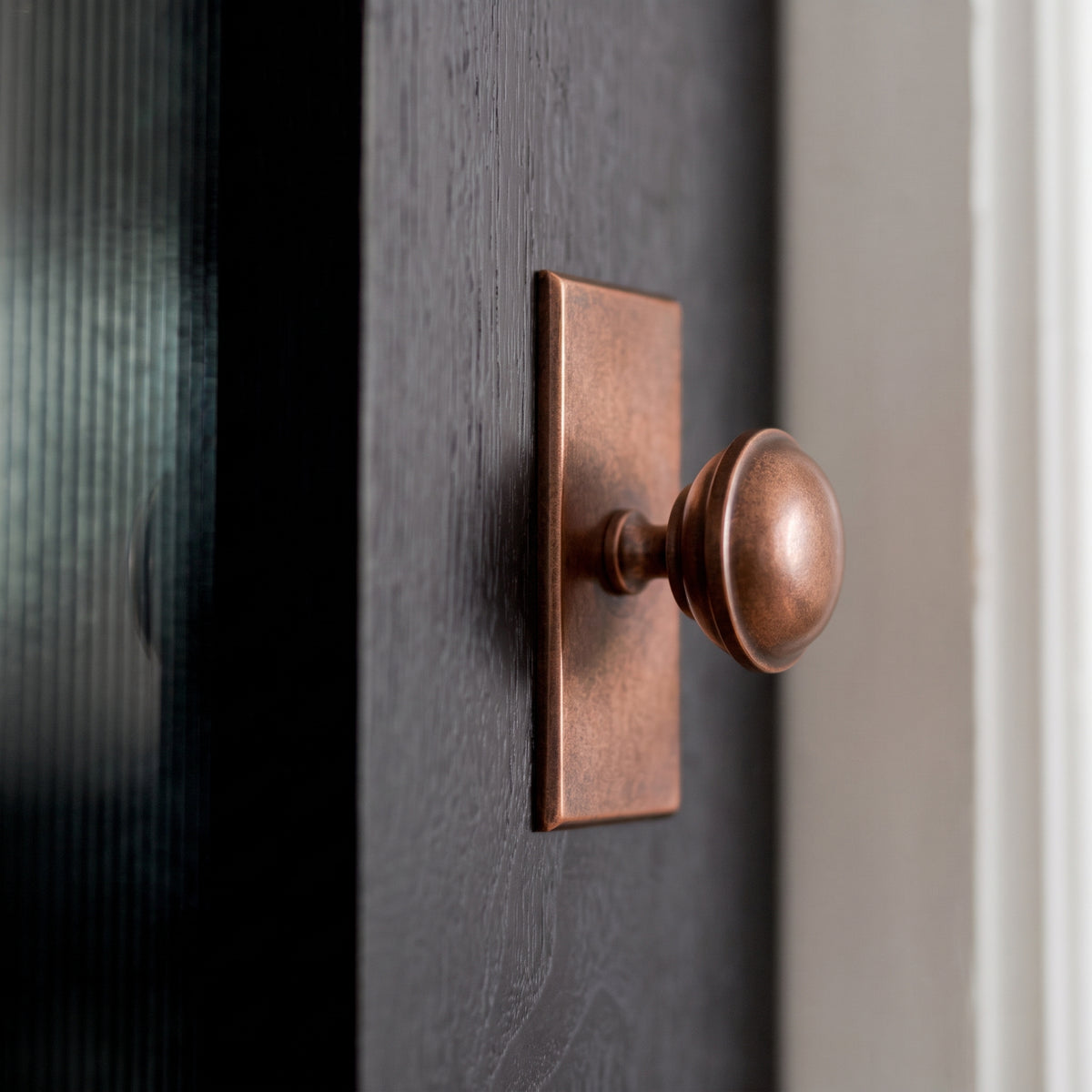 Queslett Cabinet Knob rectangular — room setting, Aged copper