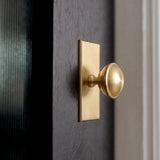 Queslett Cabinet Knob rectangular — room setting, Satin brass unlacquered