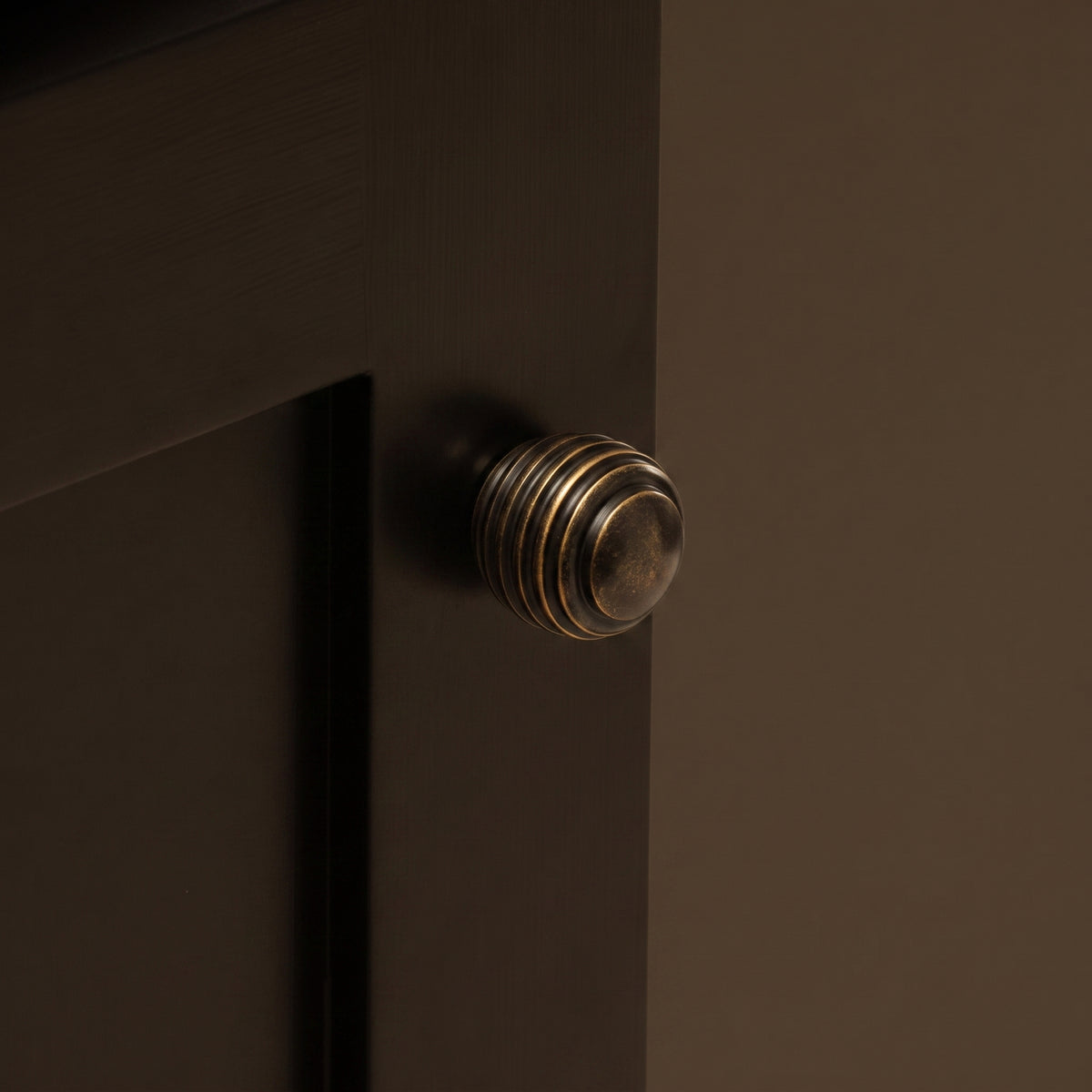 Nelson Cabinet Knob — room setting, Dark antique brass